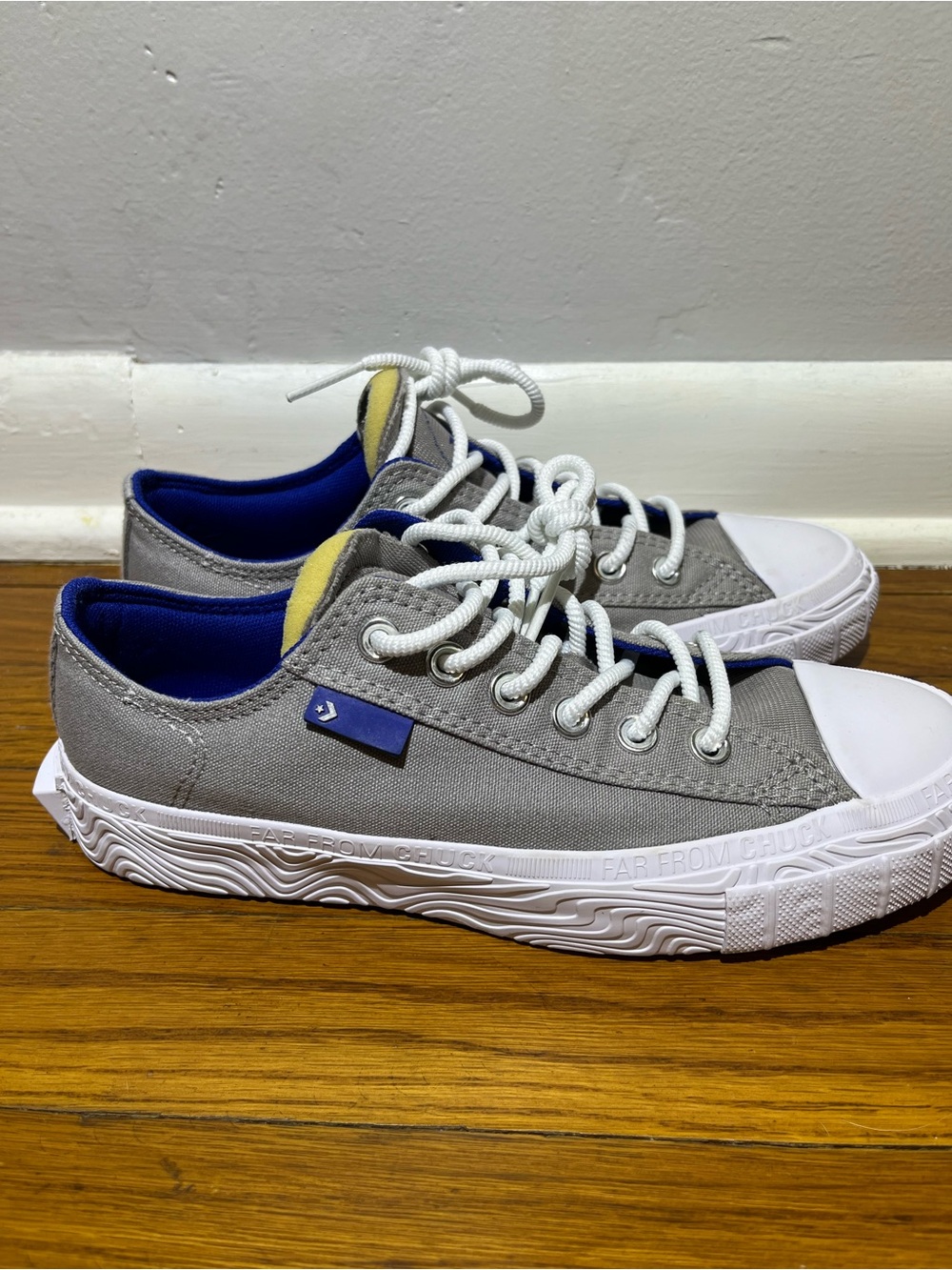 Converse Far From Chuck Gray White Sneakers with Blue Accents and Exposed Tongue